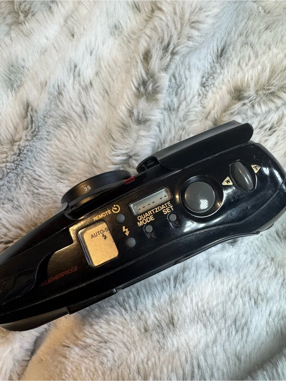 Olympus compact film camera in black with built-in flash